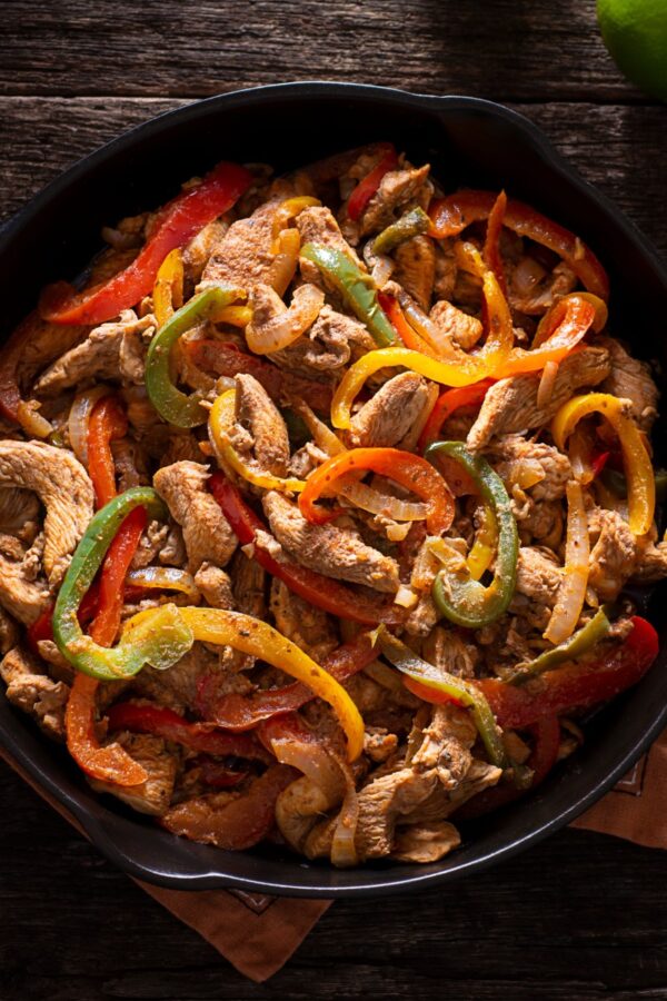 Overhead image of Chicken and Peppers in a cast iron skillet