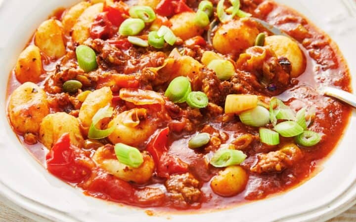 Gnocchi Bolognese in a decorative white bowl