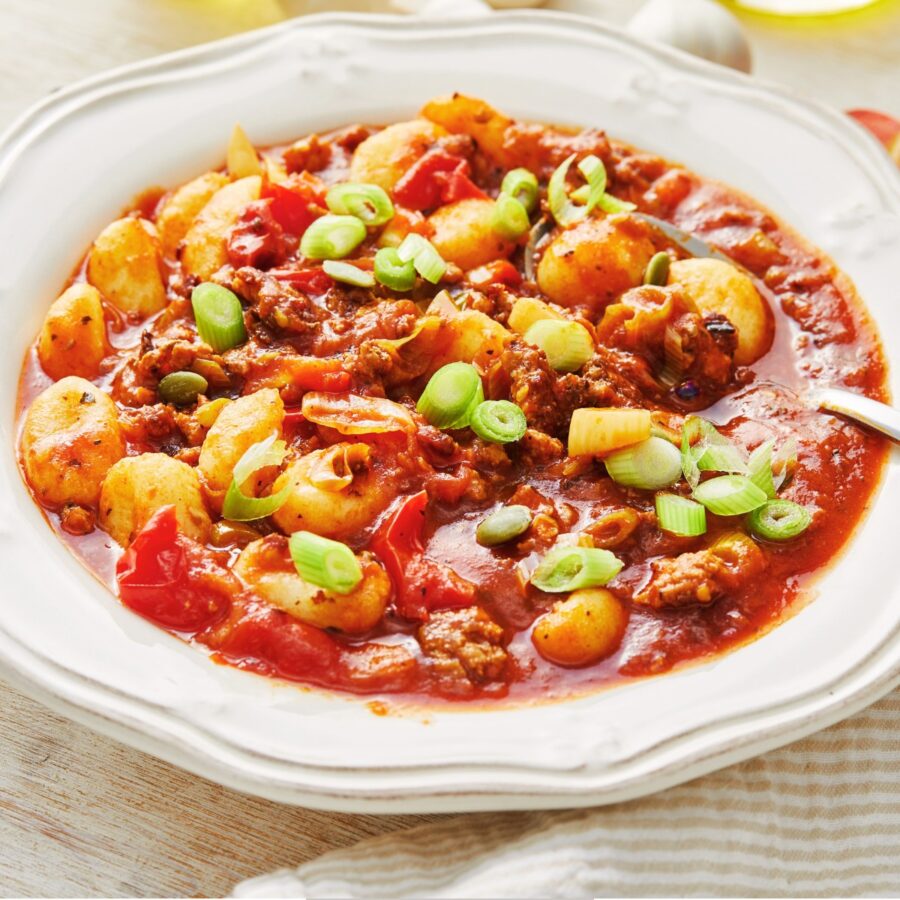 Gnocchi Bolognese in a decorative white bowl