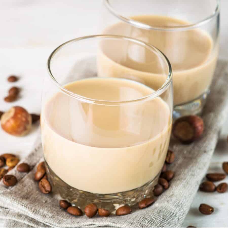 Overhead image of Homemade Irish Cream in glasses with coffee beans around them