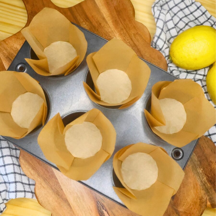Overhead image of muffin liners in a 6 cup muffin tin