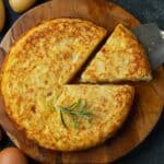 Overhead image of a Potato Frittata with a slice cut out of it