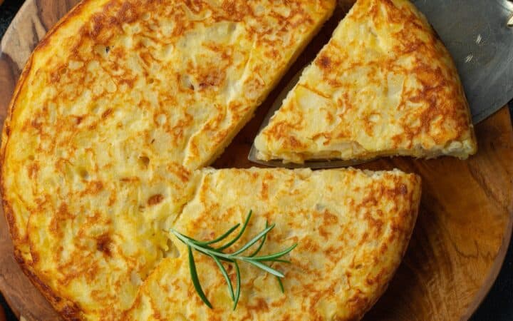 Overhead image of a Potato Frittata with a slice cut out of it