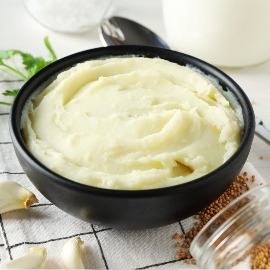 Sour Cream Mashed Potatoes in a black bowl