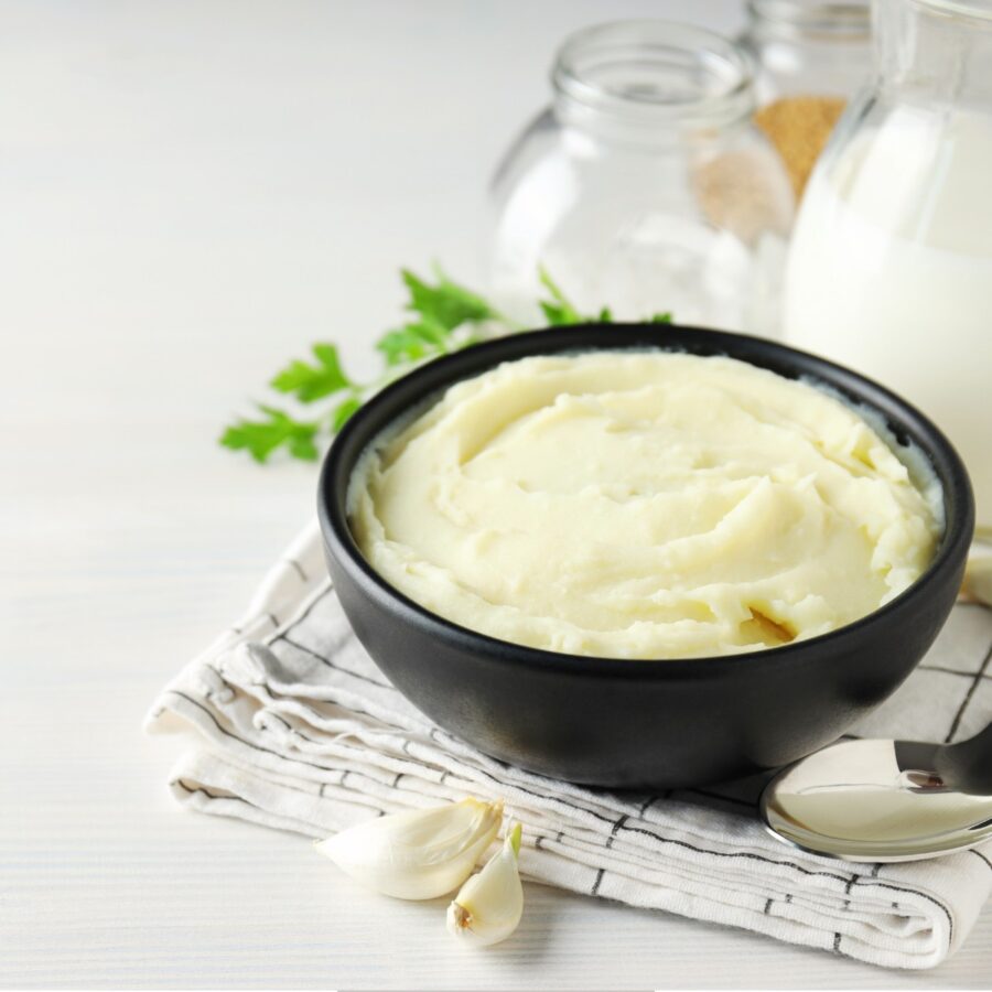 Overhead image of Sour Cream Mashed Potatoes on a light background