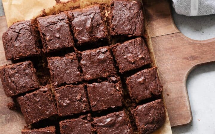 Overhead image of Cottage Cheese Brownies on a wooden cutting board