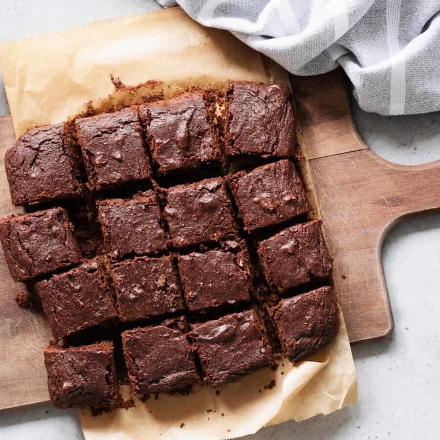 Overhead image of Cottage Cheese Brownies on a wooden cutting board