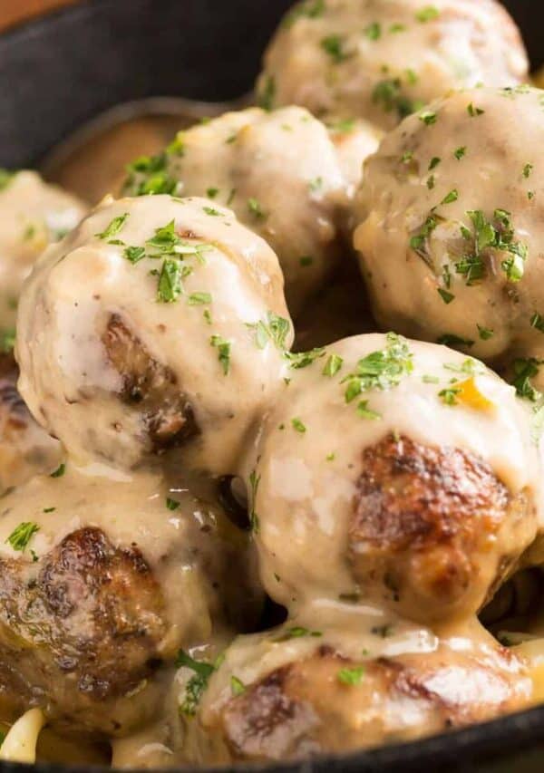 Overhead image of Crockpot Swedish Meatballs in a bowl with egg noodles