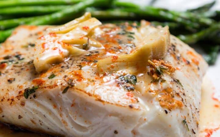 Air Fryer Halibut on a white plate with green beans