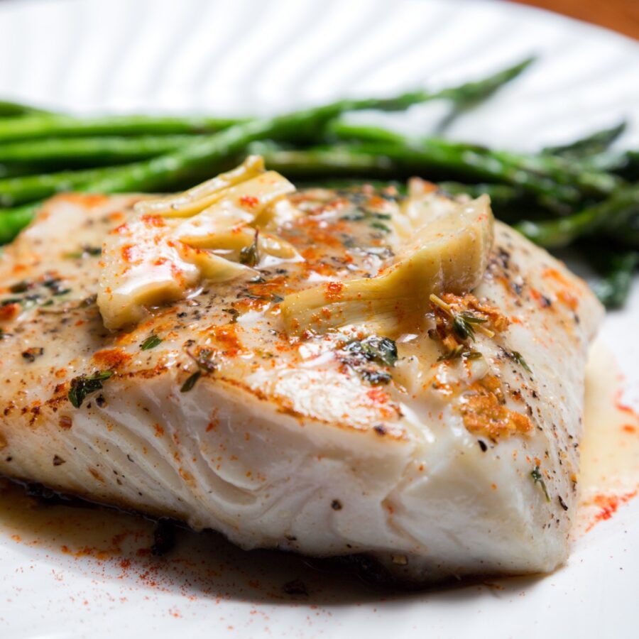 Air Fryer Halibut on a white plate with green beans