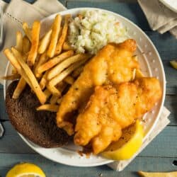 Overhead image of Beer Battered Fish on a plate with sides