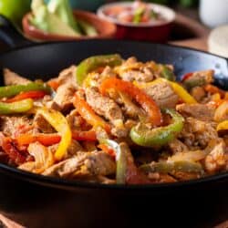 Close up image of Chicken and Peppers in a skillet