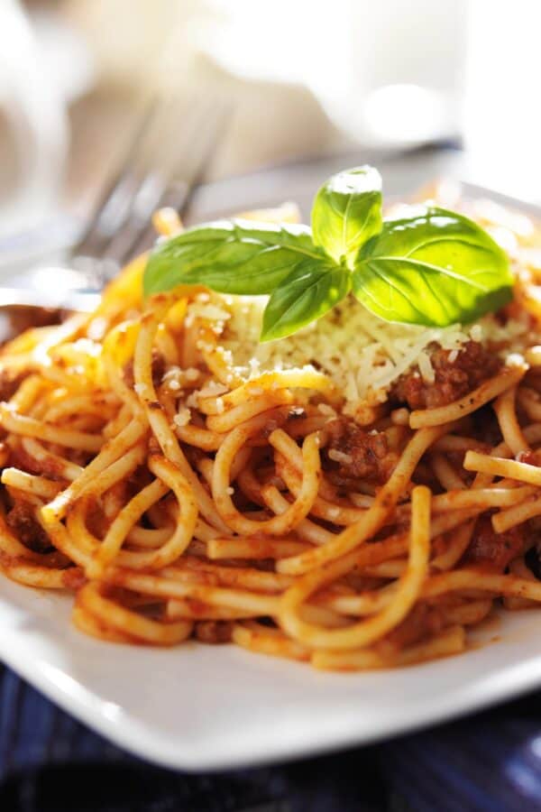 Sausage Spaghetti on a square white plate