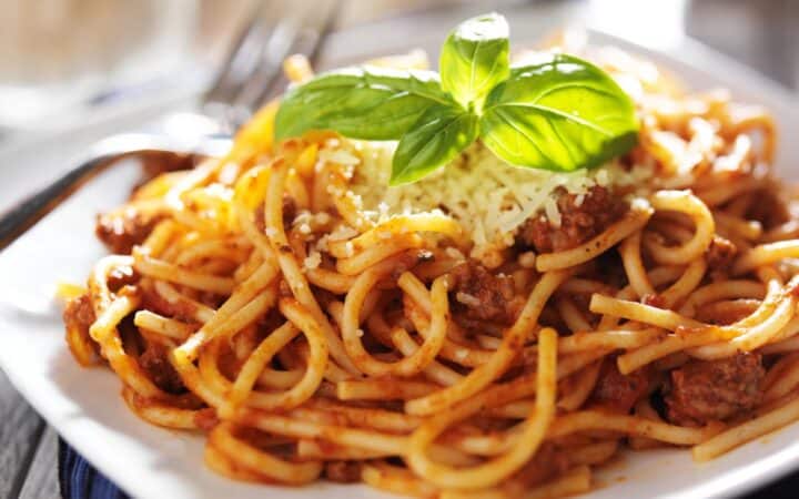 Sausage Spaghetti on a square white plate