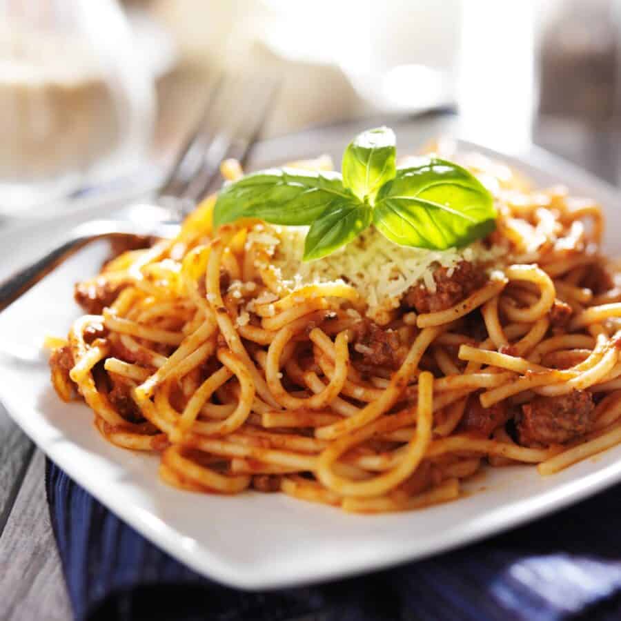 Sausage Spaghetti on a square white plate