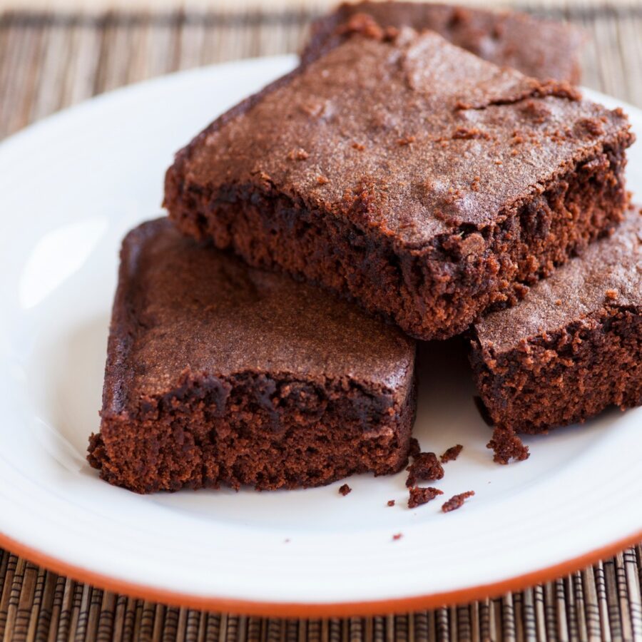 A stack of Cottage Cheese Brownies on a white plate