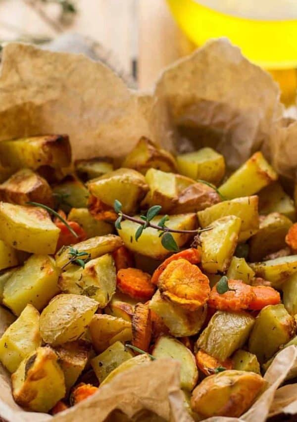 Air Fryer Carrots And Potatoes in a bowl with parchment paper