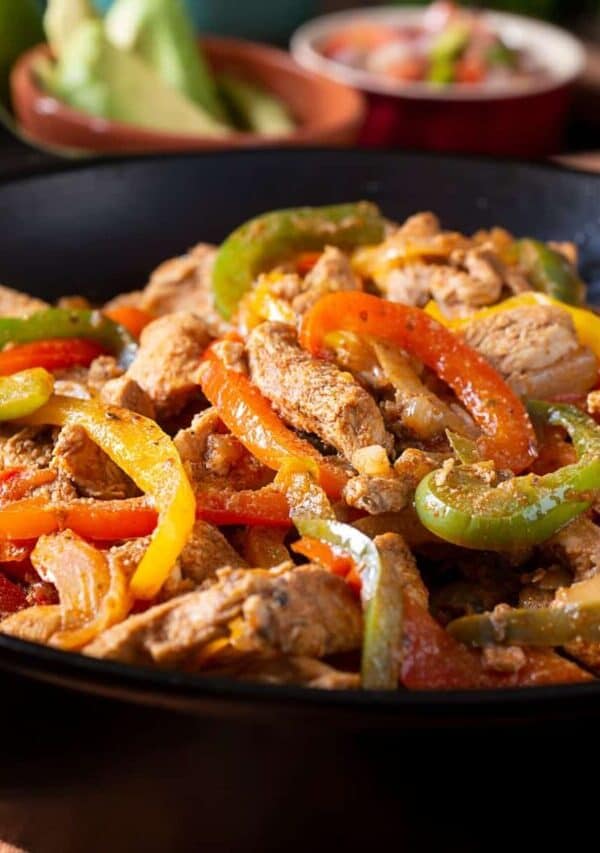 Close up image of Chicken and Peppers in a skillet