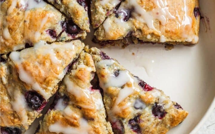 Overhead image of blueberry scones on a white serving platter