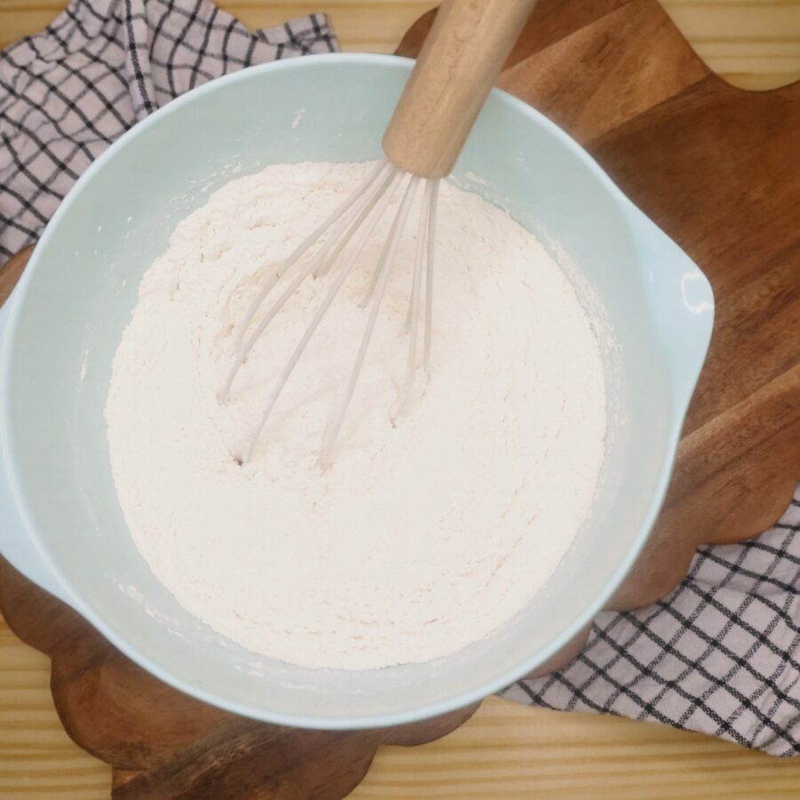 Dry ingredients for blueberry scones in a bowl with a whisk
