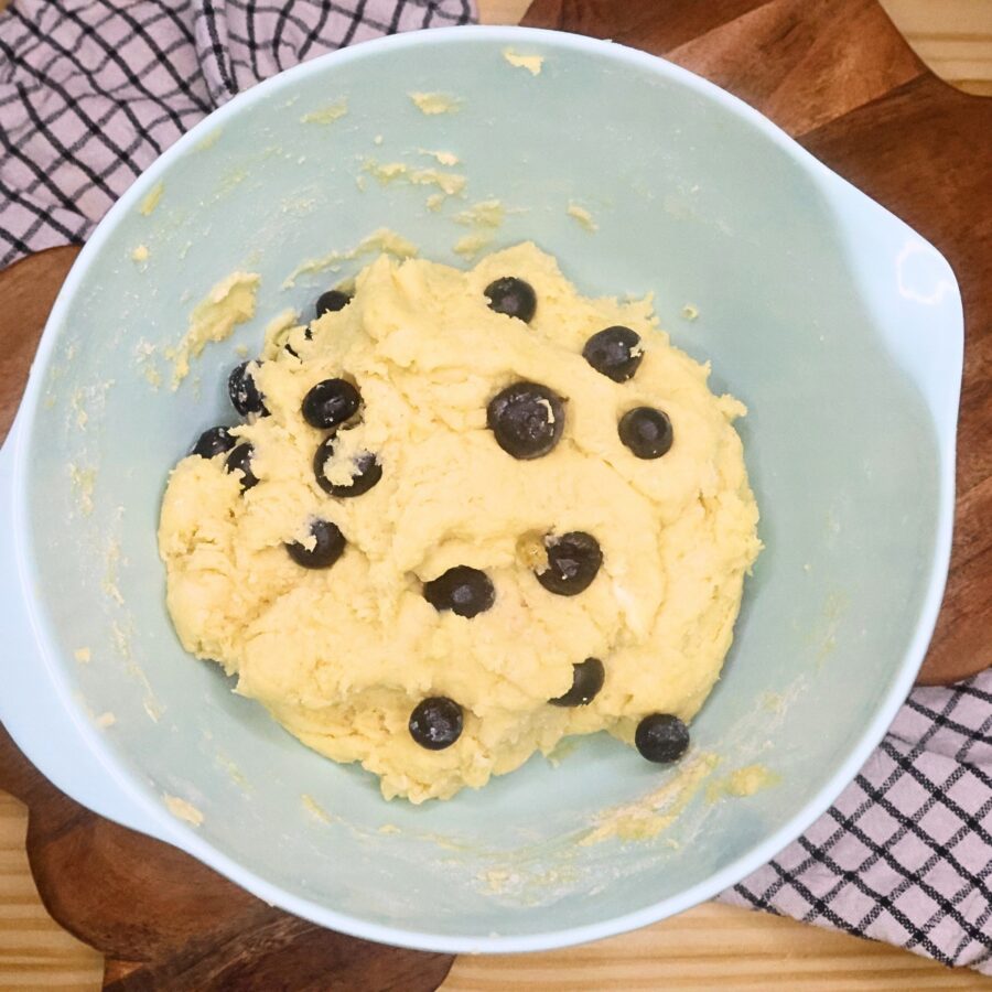 Scone dough with blueberries folded in