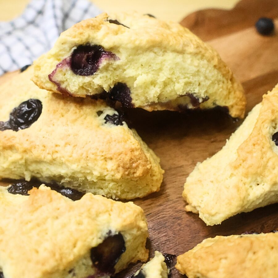 Close up image of Blueberry Scones on a wooden surface