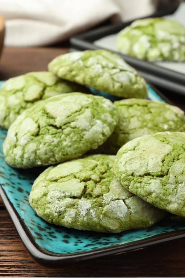 A stack of Matcha Cookies on a teal platter