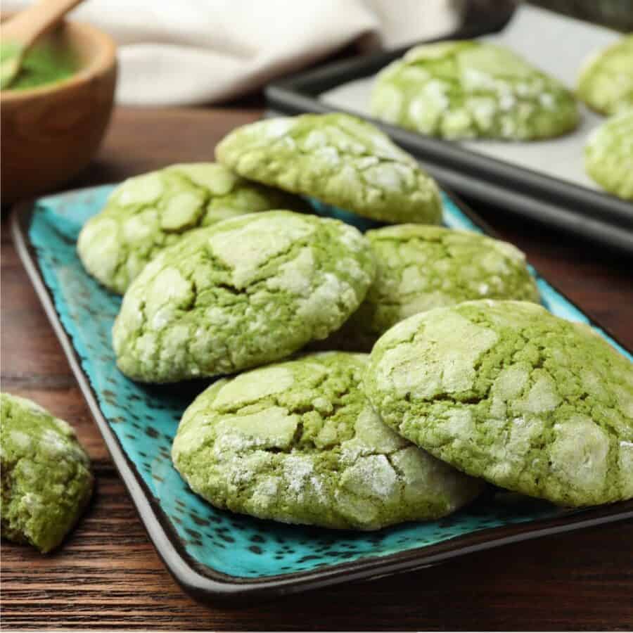 A stack of Matcha Cookies on a teal platter