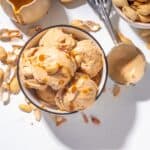 Overhead image of Peanut Butter Ice Cream in a bowl with peanuts scattered around it - 8