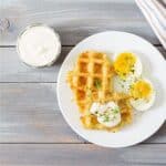 Close up image of Potato Waffles with over easy eggs - 8
