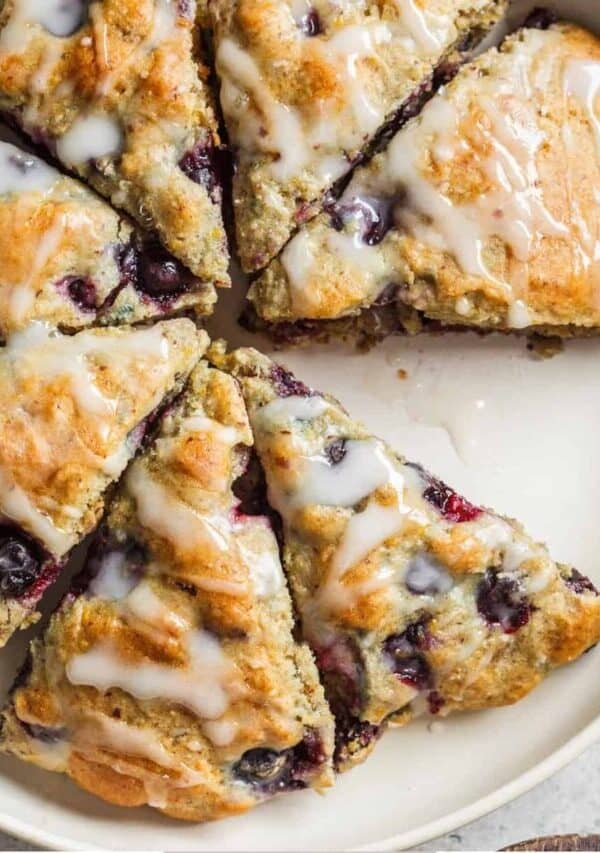 Overhead image of blueberry scones on a white serving platter