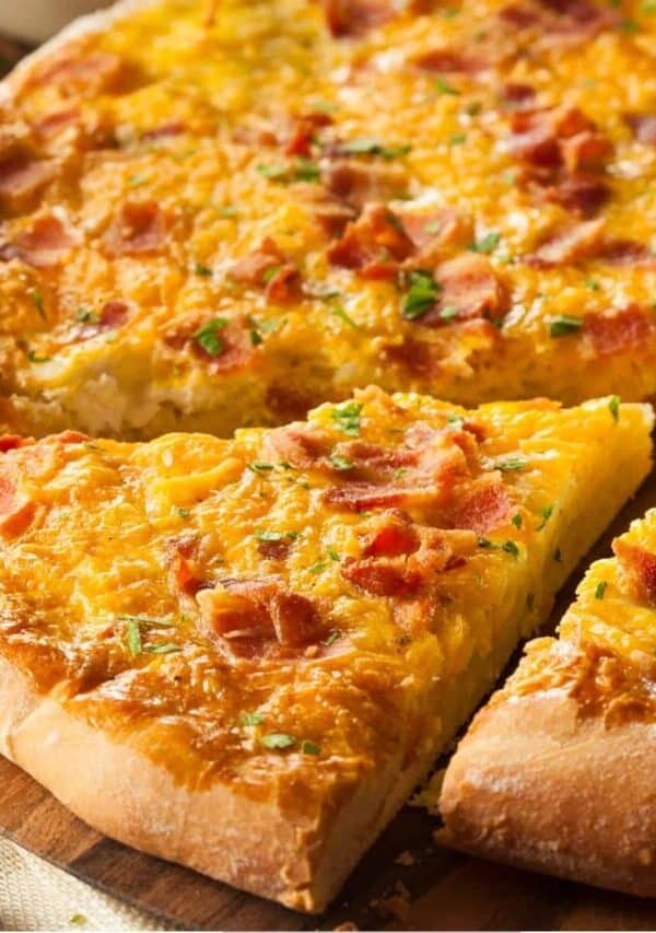 Close up image of a slice cut out of a Breakfast Pizza