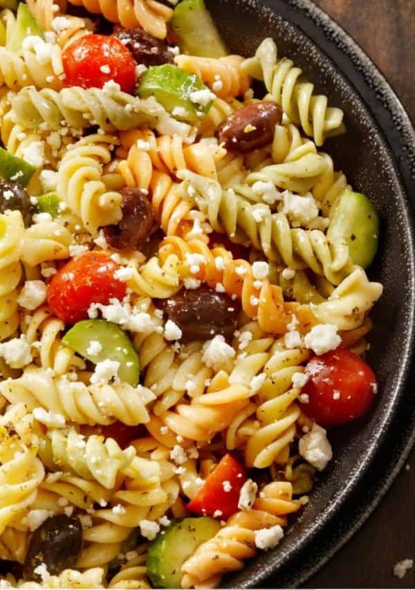 Overhead image of Greek Pasta Salad in a black bowl