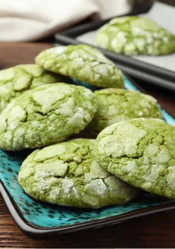 A stack of Matcha Cookies on a teal platter