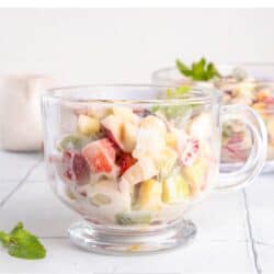 Close up image of Cheesecake Fruit Salad in a glass mug