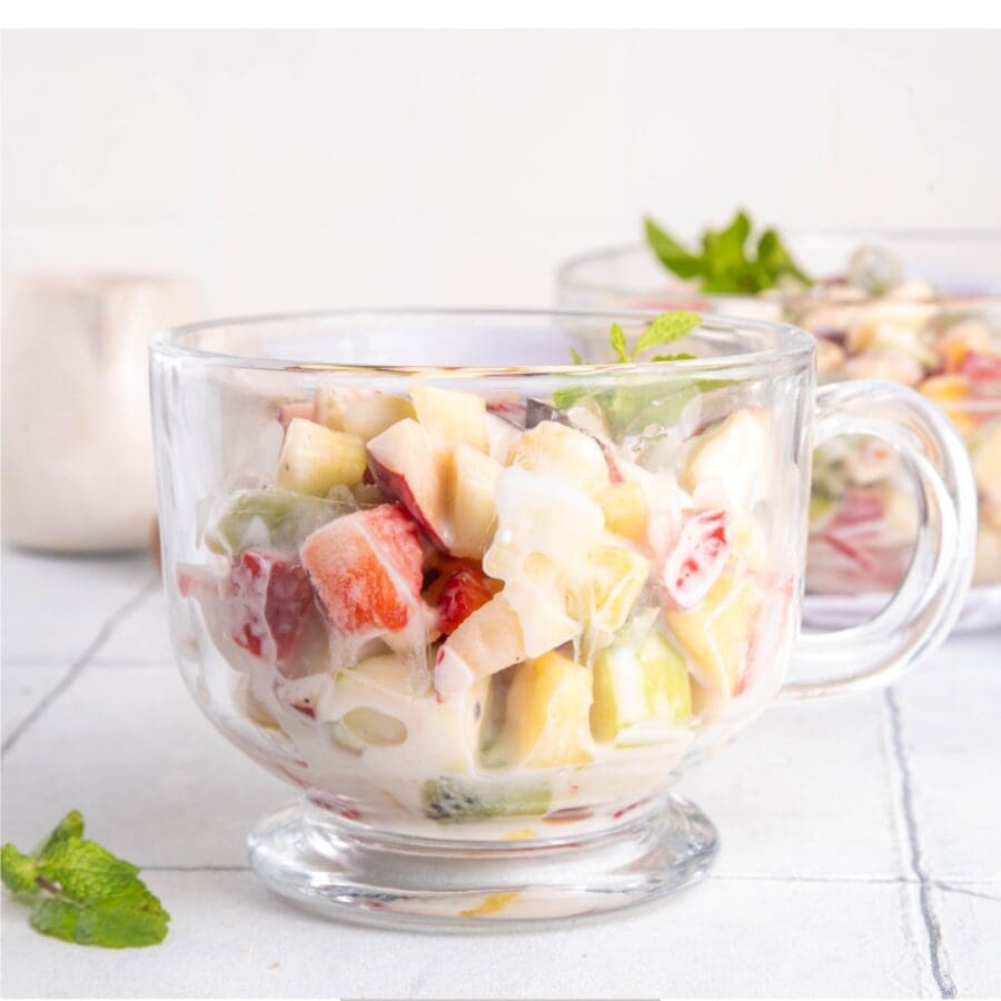Close up image of Cheesecake Fruit Salad in a glass mug