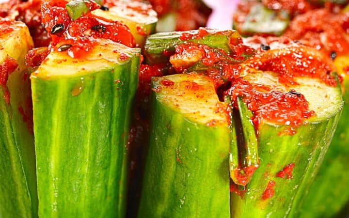 Close up image of Cucumber Kimchi standing on end in a bowl