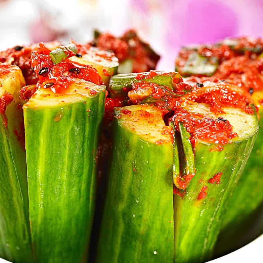 Close up image of Cucumber Kimchi standing on end in a bowl