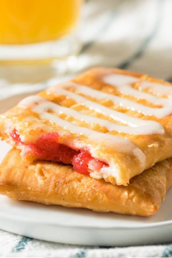 A white plate with Toaster Strudel stacked on top