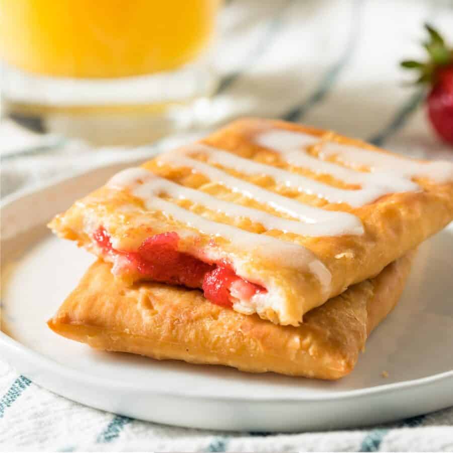 A white plate with Toaster Strudel stacked on top