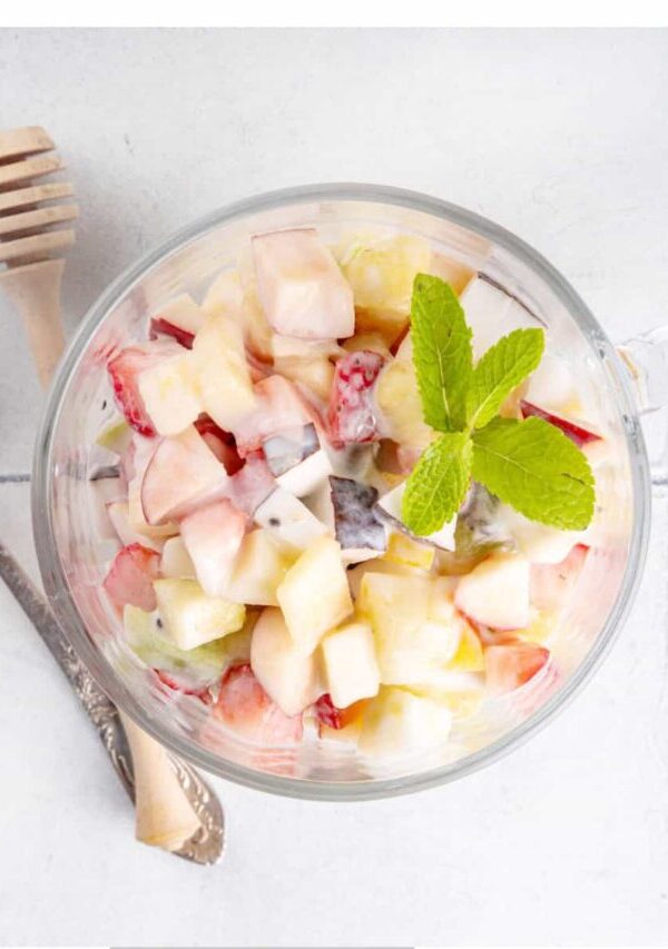 Overhead image of Cheesecake Fruit Salad in a glass mug