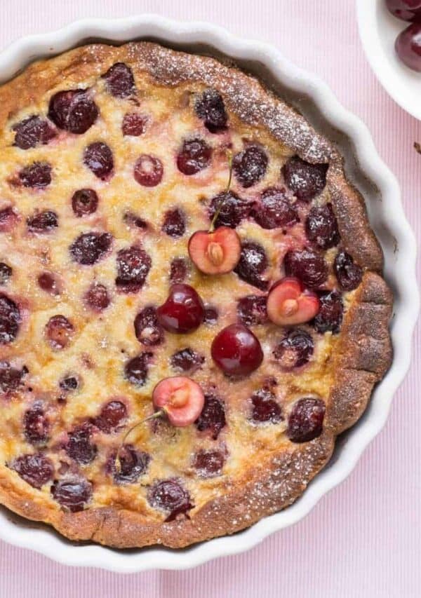 Overhead image of a Cherry Clafoutis in a white pie plate