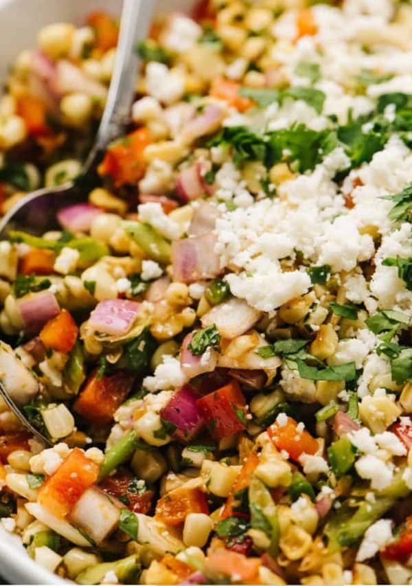 Close up image of Mexican Street Corn Salad in a white bowl
