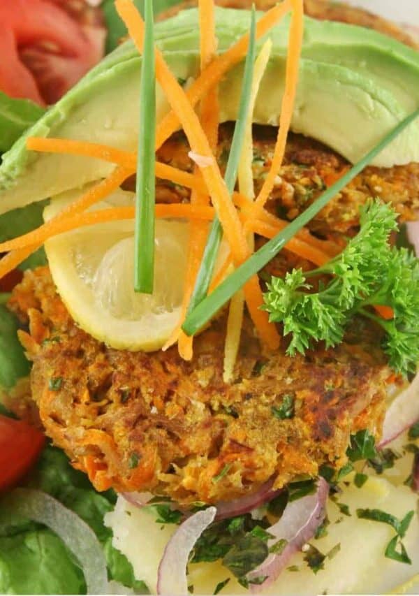 Overhead image of Tuna patties over a simple salad with avocado