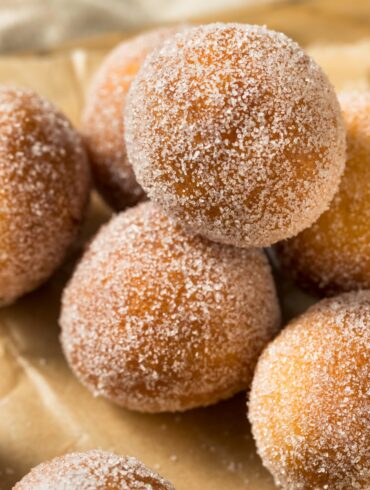 Close up image of Air Fryer Donut Holes on a neutral background