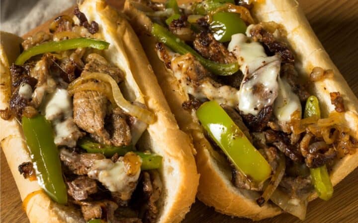 Close up image of two Philly Cheesesteaks