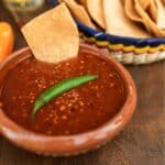 Salsa Roja in a bowl with chips in the background - 8