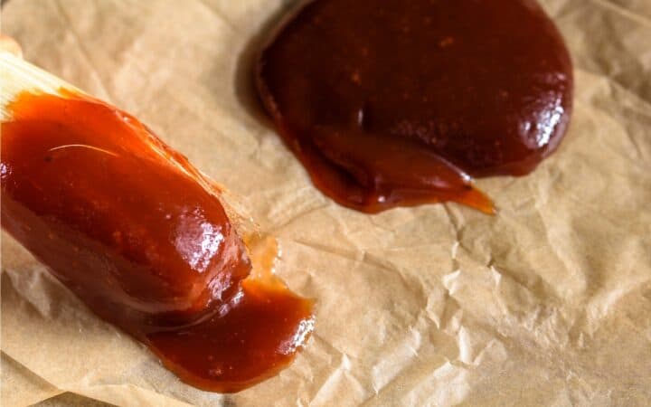 Steak Sauce on a brush and poured on to parchment paper