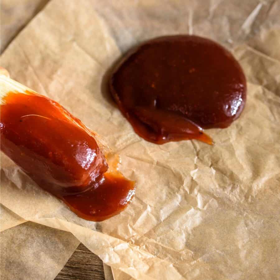 Steak Sauce on a brush and poured on to parchment paper