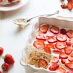 Close up image of Strawberry Tiramisu in a baking dish with a portion missing - 7